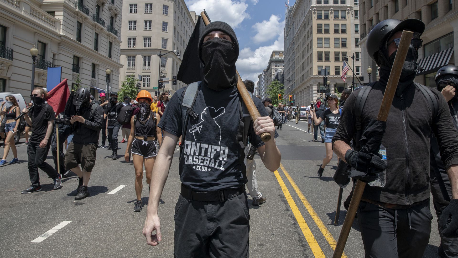 Antifa marching with clubs